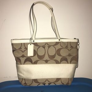 Brown and white Coach purse